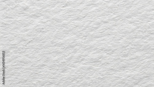 Close-up of a rough gray textured surface resembling plaster or concrete, ideal as a seamless neutral background for design, web, or print projects.