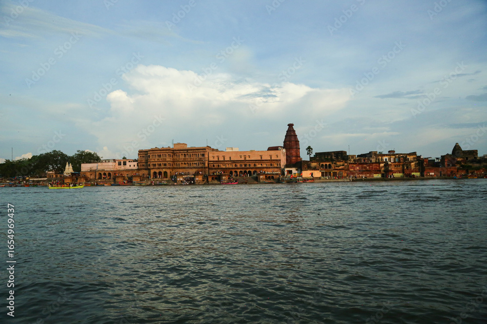 Fototapeta premium Boat riding view in Ancient Shri Yamuna Temple ghat view, Vrindavan, Mathura, Uttar Pradesh, India. Ancient Shri Yamuna Temple ghat view, Vrindavan, Mathura, Uttar Pradesh, India.8 April 2025 