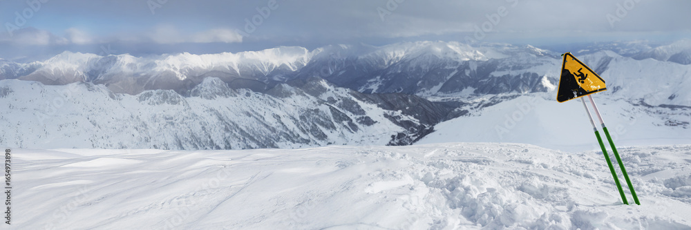 Obraz premium Snowy Mountain Landscape with Warning Sign, Wide Banner