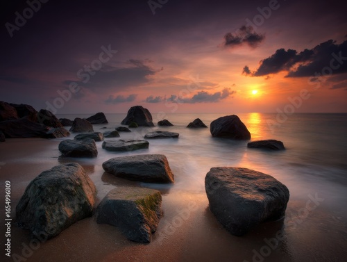 Serene Seascape at Sunset Rocks in Ocean Waves Long Exposure Photography Dramatic Sky Coastal Scene
