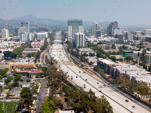 Glendale, CA, LA County, August 14, 2025: Aerial View of Glendale CA around Fremont Park with Glendale Downtown, Buildings, Streets, Homes, Apartments, Mountain, and 134 Freeway
