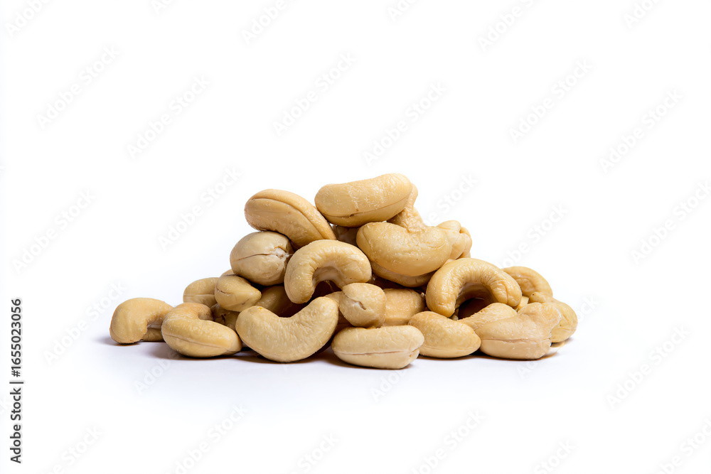Fototapeta premium a pile of cashews on a white surface