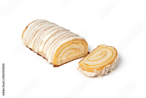 a loaf of cake with icing and a slice cut out
