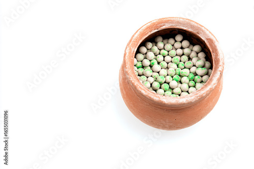 a pot filled with green and white peas