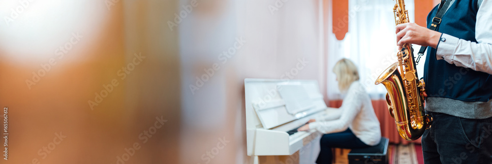 Naklejka premium Musicians Playing Piano and Saxophone Wide Banner