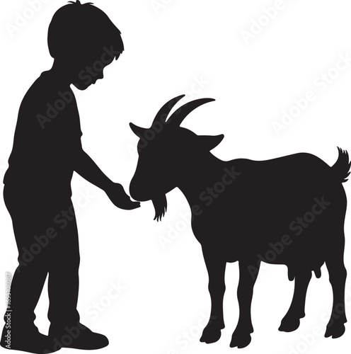 Silhouette of a young boy feeding a goat child animal