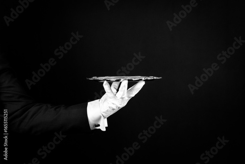Isolated Image of White Gloved Hand Holding Serving Tray. Butler At Your Service.