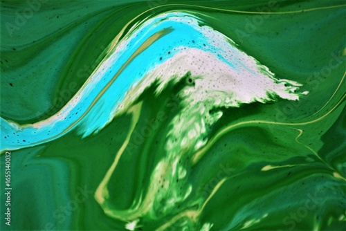 Abstract background of acrylic paint in green and white tones. Liquid marble pattern