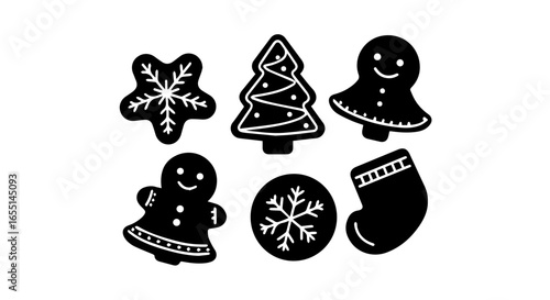 A collection of black Christmas cookie silhouettes with white icing details including gingerbread people a tree a stocking and snowflakes.