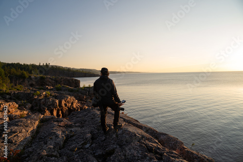 Person Enjoying Sunset by Lake Superior, Minnesota