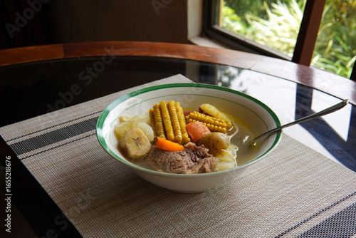 Typical Costa Rican soup called olla de carne with corn, potato, chayote, green plantain, carrot, typical Mexican and Central American food, broth called caldo de res or meat soup