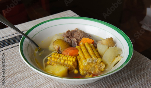 Typical Costa Rican soup called olla de carne with corn, potato, chayote, green plantain, carrot, typical Mexican and Central American food, broth called caldo de res or meat soup
