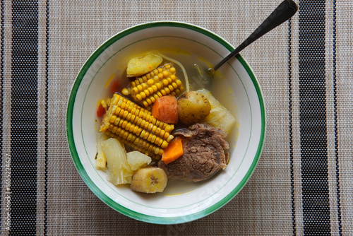 Typical Costa Rican soup called olla de carne with corn, potato, chayote, green plantain, carrot, typical Mexican and Central American food, broth called caldo de res or meat soup