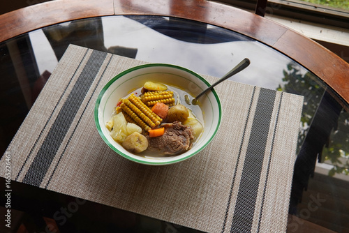 Typical Costa Rican soup called olla de carne with corn, potato, chayote, green plantain, carrot, typical Mexican and Central American food, broth called caldo de res or meat soup