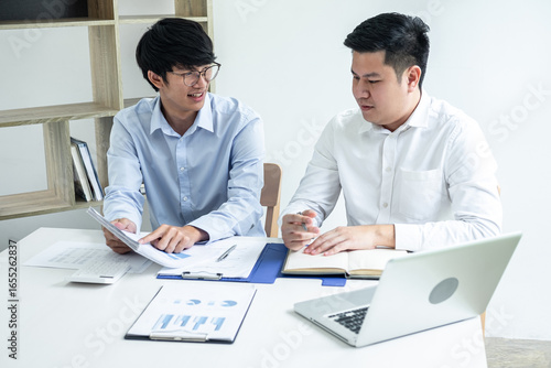 Two business partner team meeting and discussion financial project of investment ideas, presentation and analyzing marketing planning strategy of business making to growth profit and successful