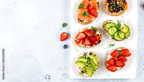 Colorful and fresh gourmet toast with various toppings, arranged attractively on a light surface.