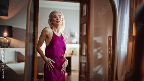 Dress woman admiring reflection in modern living room closeup. Lady spinning