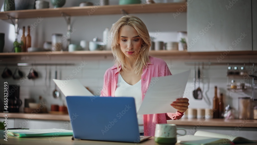 Remote accountant taking papers working closeup. Positive lady looking documents Remote accountant taking papers working closeup. Positive lady looking documents