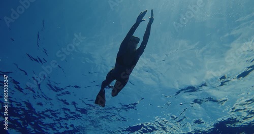 Wallpaper Mural Woman swimming underwater dancing in deep blue crystal clear water  Torontodigital.ca