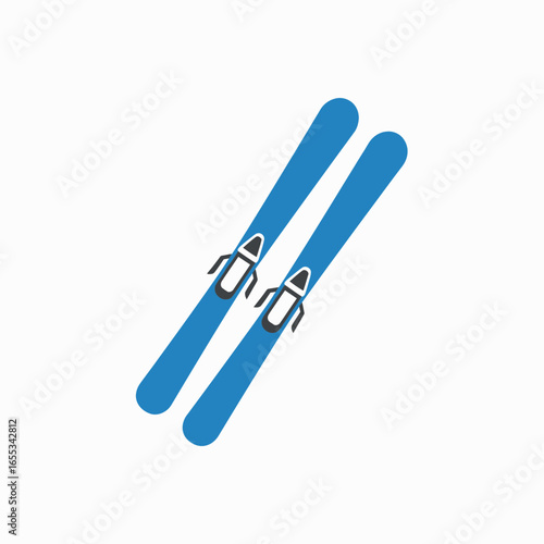 Pair of blue skis with bindings isolated on a white background.