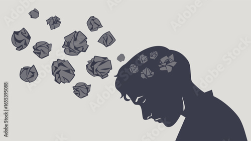 Silhouette of a Person with Crumpled Paper Representing Mental Overload.