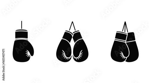 Collection of four different boxing gloves hanging isolated on white background