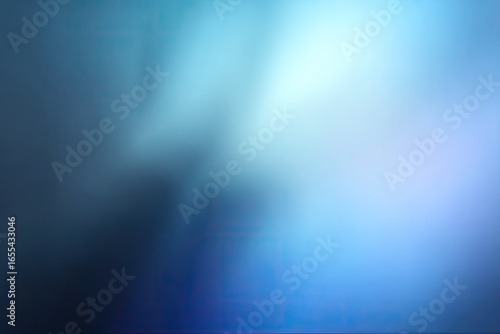 Abstract gradient of soft blues and dark tones. Blurry transitions of color create a serene and hazy ambiance