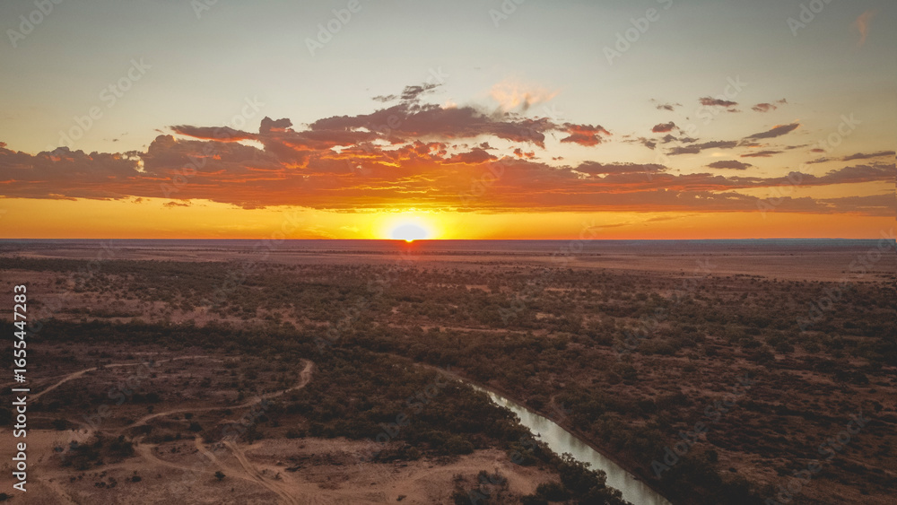Naklejka premium Sunset over King Creek, Bedourie, Queensland, Australia