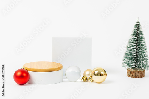 A white box with a red ball on top of it