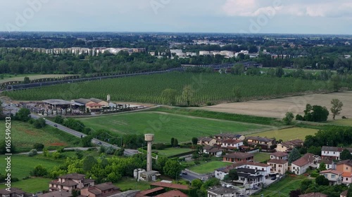 Wallpaper Mural Aerial view of Iron bridge linking Cremona, Lombardy, with Castelvetro Piacentino, Emilia-Romagna, spanning Po River floodplain with geometric poplar plantation Torontodigital.ca