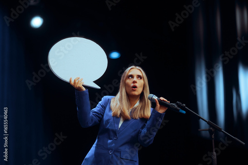 Business Woman Holding a Speech Bubble Making a Presentation. Puzzled speaker trying to deliver the message to her audience
