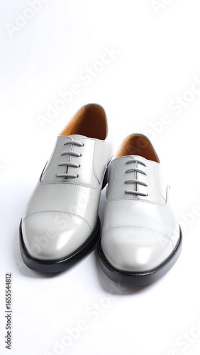 Wallpaper Mural Pair of light grey leather oxford shoes with black soles, presented on a white background Torontodigital.ca