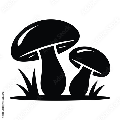 Two black silhouette mushrooms growing in grass