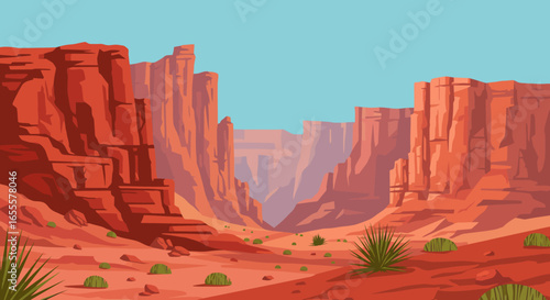 Red rock canyon landscape with arid terrain sparse vegetation under a clear blue sky