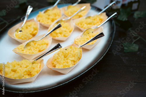 Elegant Portions of Creamy Risotto in Tasting Spoons on Tray