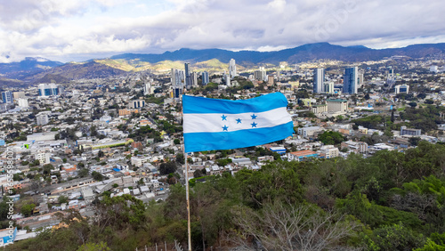 Honduras National Flag Waving on Flag Pole in Tegucigalpa, Honduras, the capital city of Honduras.