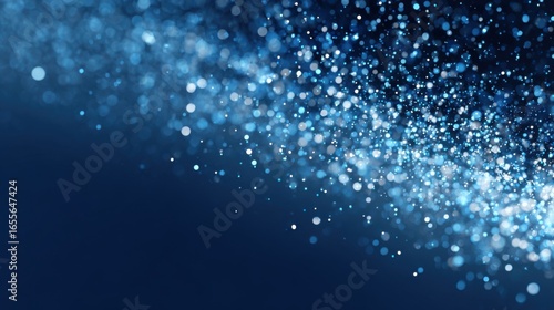 A collection of shimmering blue particles floats gracefully against a dark background. This magical display evokes feelings of wonder and tranquility.