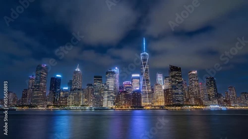 Iconic Skyline of a Modern Metropolis at Night, Illuminated by City Lights and a Clear Night Sky