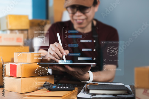 Online seller using AI chatbot on tablet for customer service and order confirmation with logistics and automation cloud icons