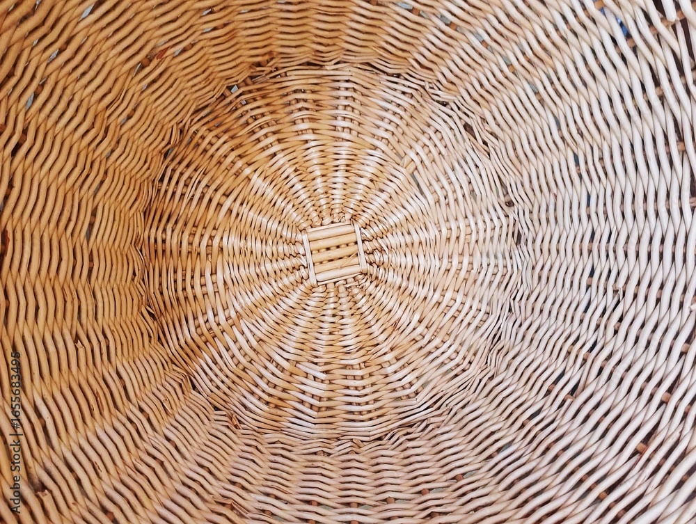 Fototapeta premium In the picture is the pattern and weaving of bamboo and light brown rattan. It is weaving for use and decoration in various events. It is a beautiful pattern and has the art of weaving in detail.
