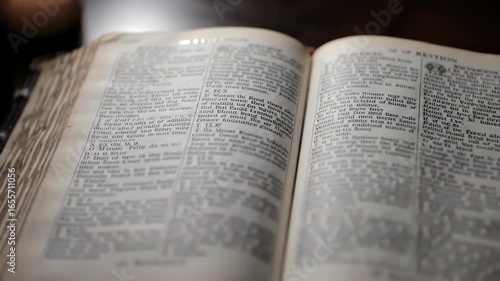Ancient Bible Open A Close-Up of the Pages of Revelation