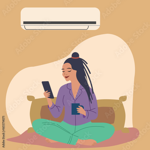 Young woman sitting crossed legged on bed turns on wall air conditioner
