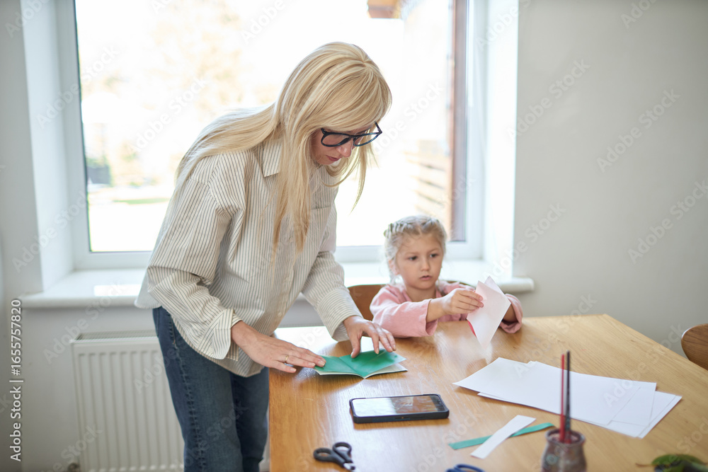 Obraz premium Teacher and a kid in a home school 