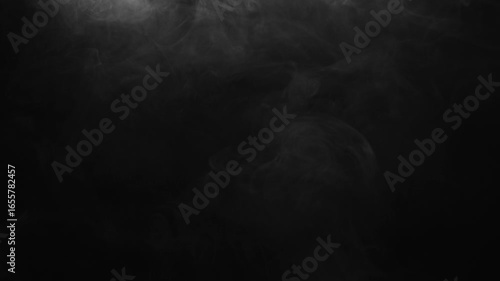 Delicate mist slowly drifting across black background. Ethereal fog or smog effect for atmospheric overlays and moody visuals.