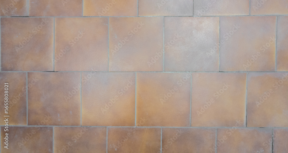 Naklejka premium Suelo de baldosines marrones.