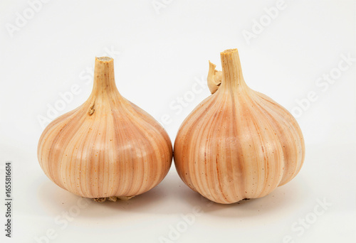 Two garlic bulbs isolated on white background, fresh and organic, healthy ingredient