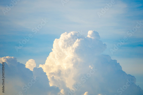 Towering clouds glowing under the soft evening sky