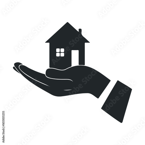 Silhouette of a hand holding a house icon symbolizing real estate and homeownership