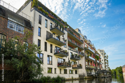 Living by the river. Modern apartment buildings on the Weiße Elster in Leipzig Saxony, Germany.
