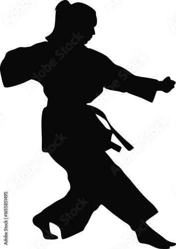 Female Martial Arts Fighter Silhouette in Karate Punching Pose
